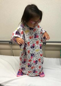 Girl in medical gown, China adoption