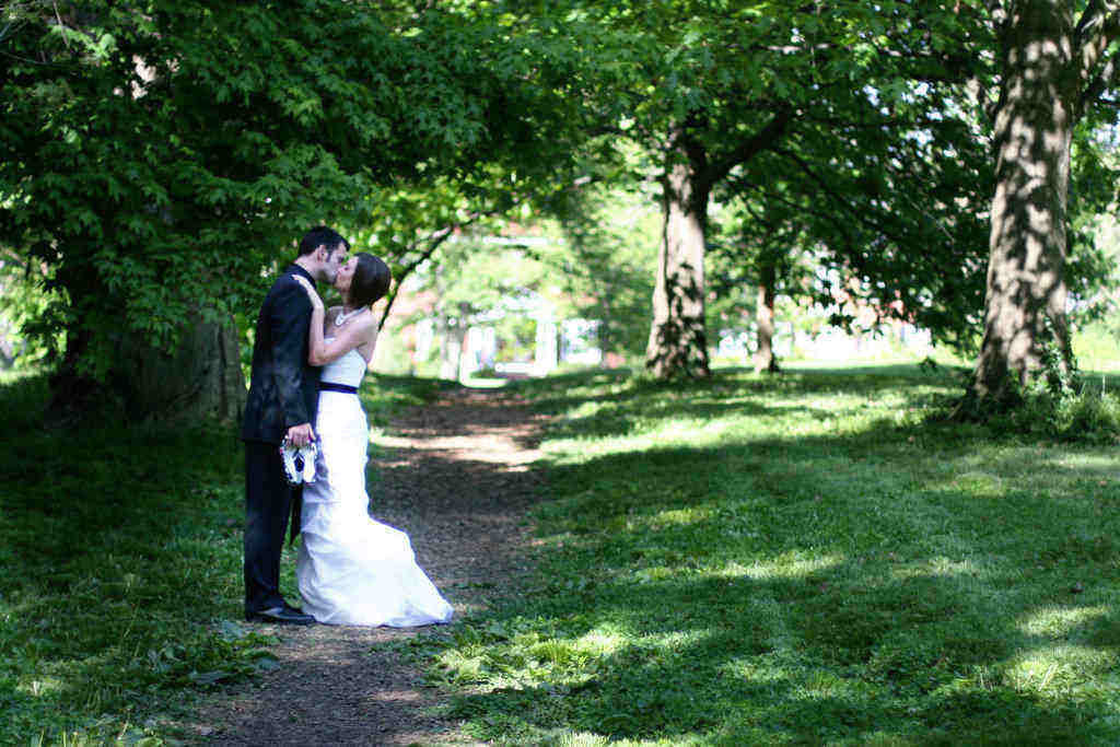Wedding photo on a path with trees