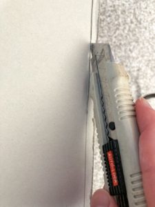 Trimming drywall with a utility knife