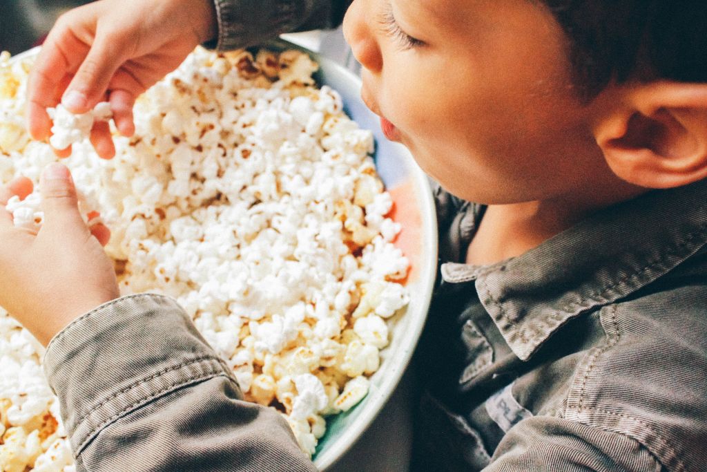 Kid eating popcorn healthy snack